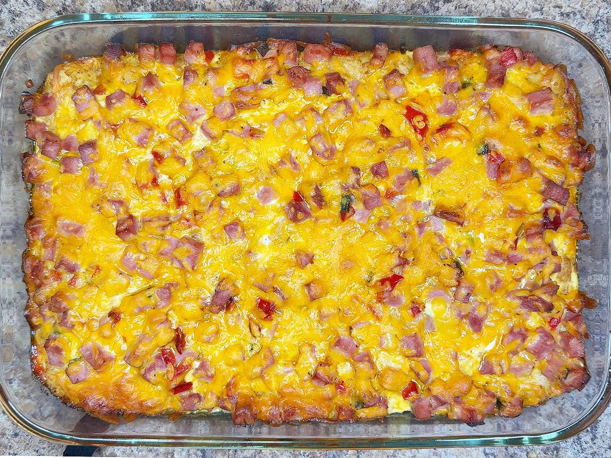 Baked ham casserole with tater tots immediately after it has come out of the oven.
