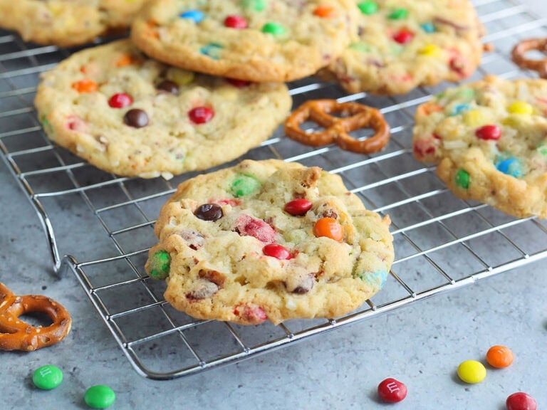 Baked loaded pretzel cookies on a baking rack.