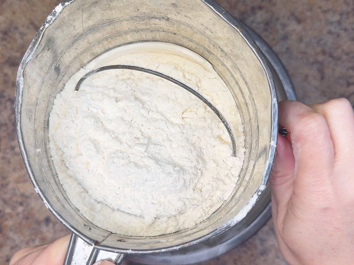 Sifting together the dry ingredients.