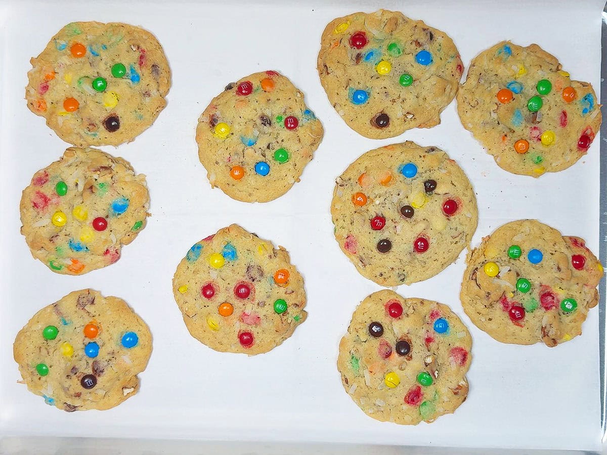 Baked cookies on a parchment paper lined baking pan.