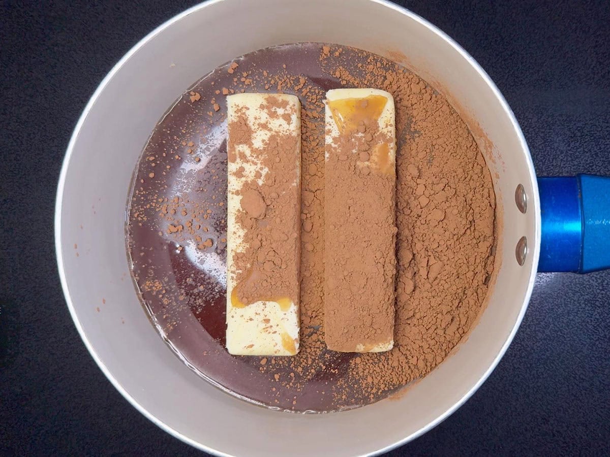Butter, Coca-Cola, and cocoa powder in a medium saucepan.