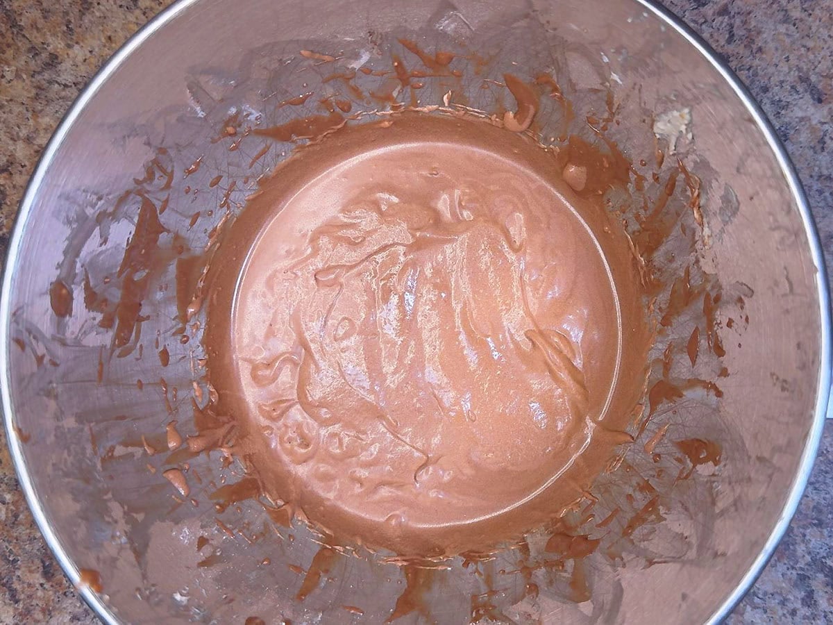 Coca-Cola, powdered sugar, vanilla extract, and cocoa powder mixed with the creamed butter.