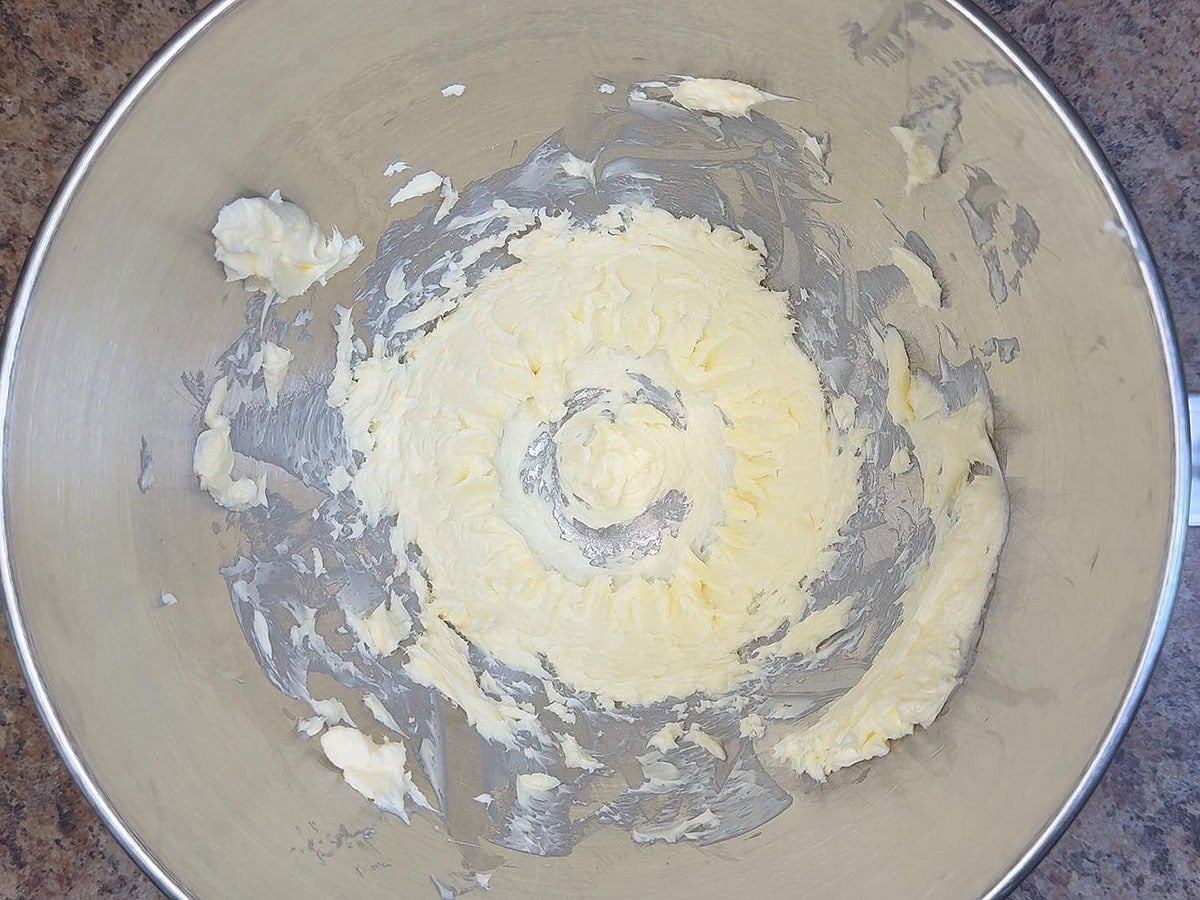 Half cup of butter creamed in a large mixing bowl.