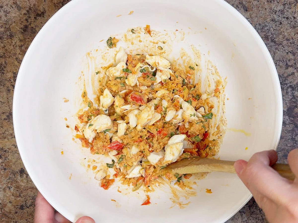 Folding the lump crab meat into the crab cake mixture.