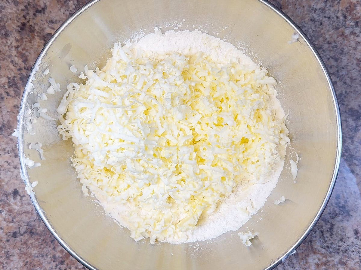 Grated butter added to the flour mixture.