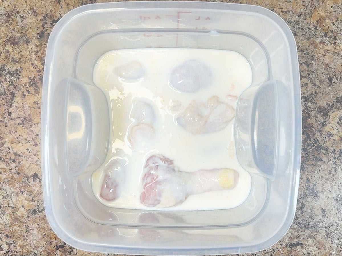 Chicken thighs and legs soaking in the buttermilk brine.