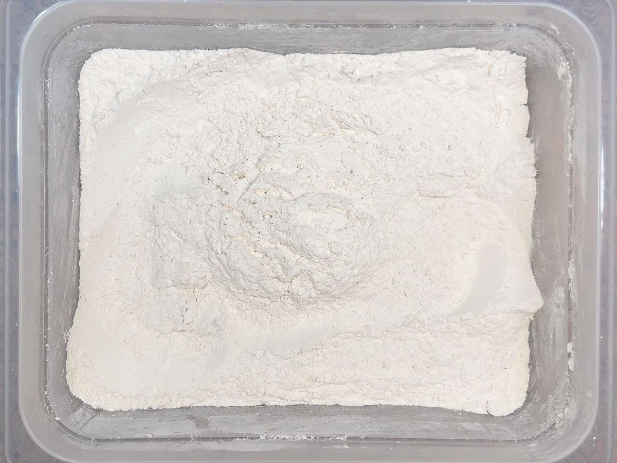 Seasoned flour ingredients mixed together in a large bowl.