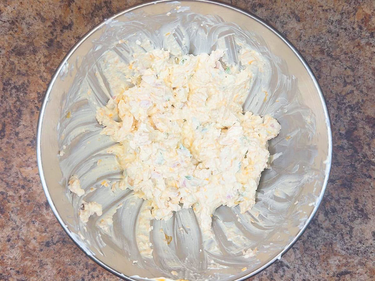 Mississippi Sin Dip ingredients mixed together in a large bowl.