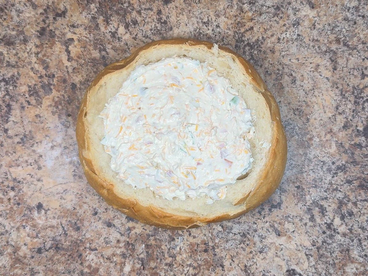 Bread bowl filled with the Mississippi Sin dip cheese mixture.