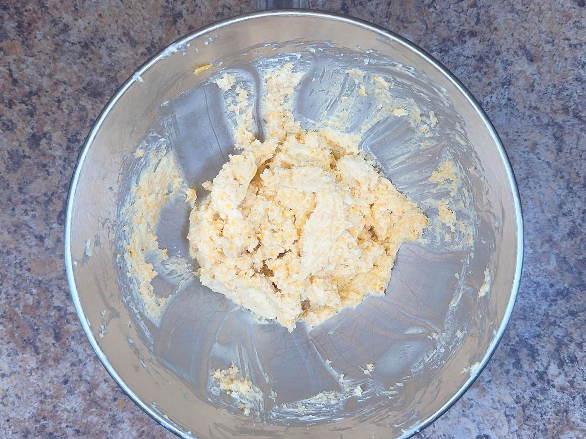 Cheese dreams ingredients mixed together in a mixing bowl.