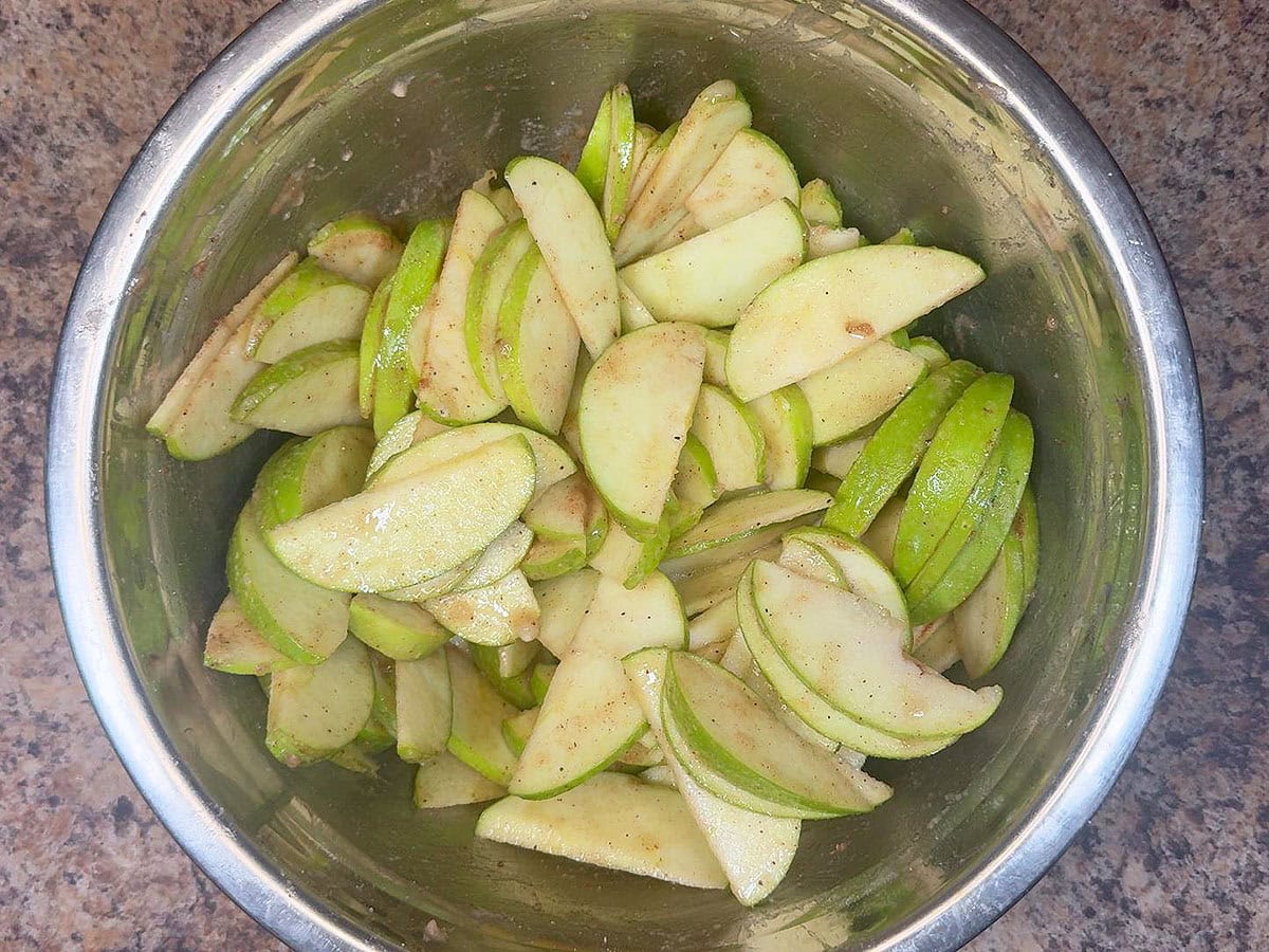 Sliced green apples tossed in cinnamon and sugar.