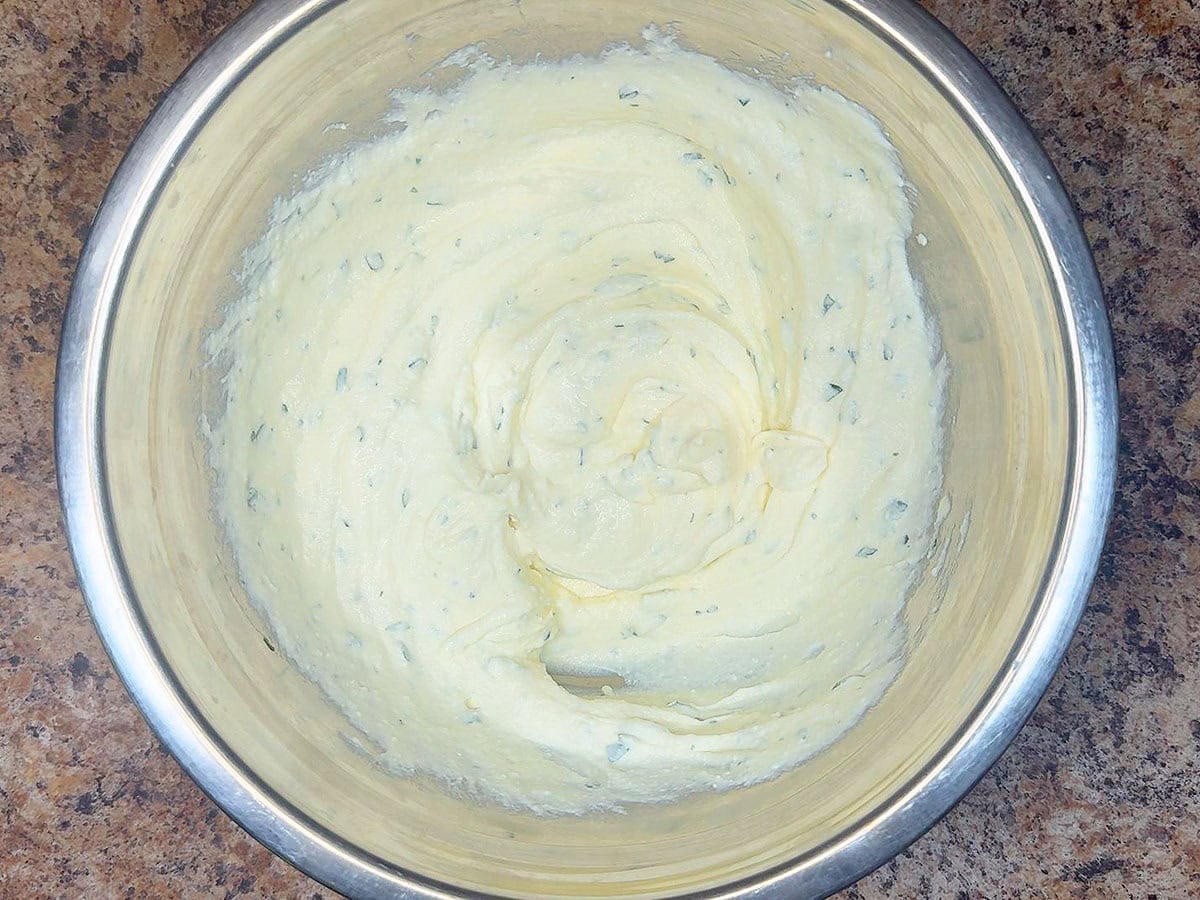 Ricotta cheese filling ingredients mixed together in a mixing bowl.