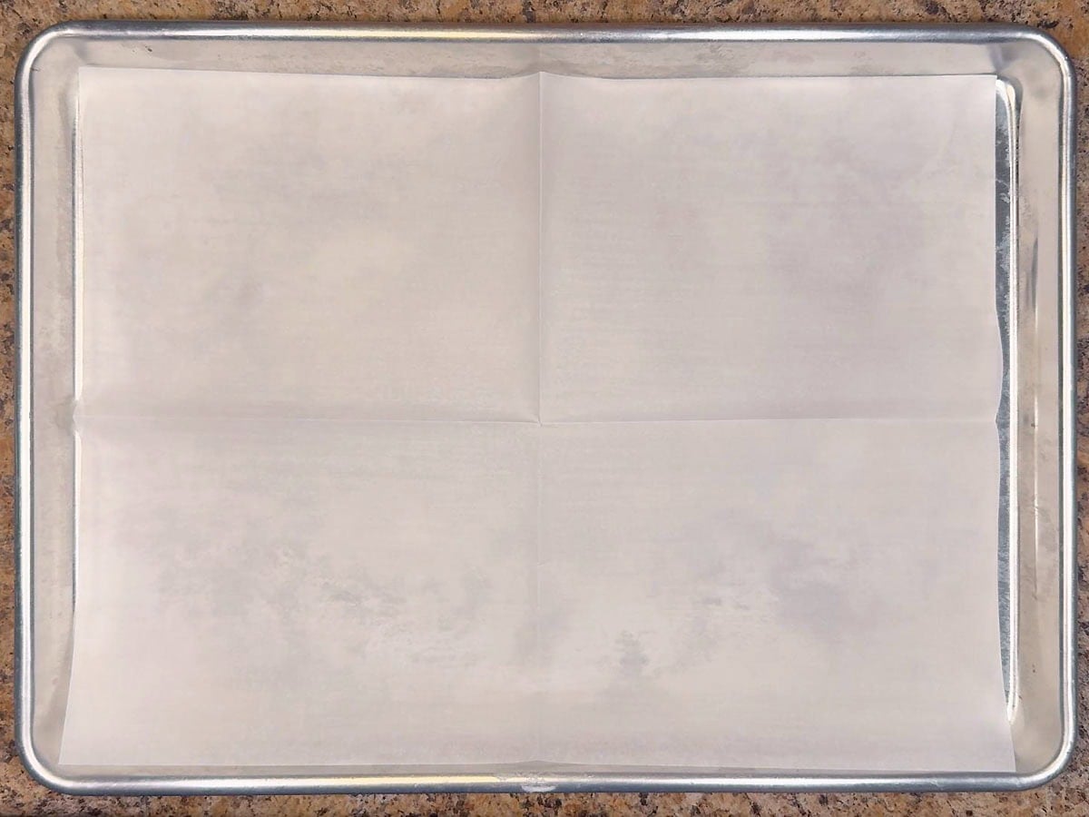 Baking sheet lined with parchment paper.