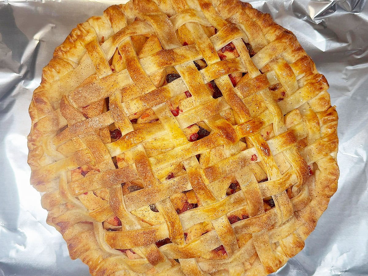 Cranberry apple pie after it has baked in the oven.